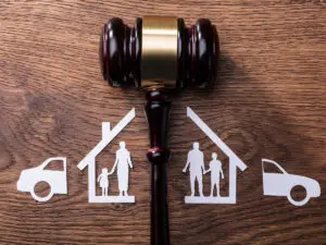 Stick Figure home divided by a judges gavel.