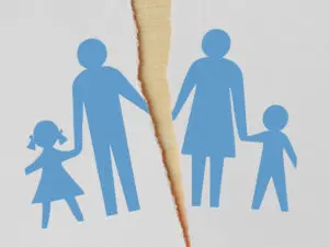 A family printing on a piece of paper being ripped down the middle.