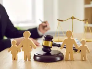 A judges desk with a gavel and wooden family