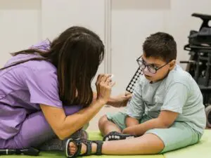 Parent supporting special needs child during care