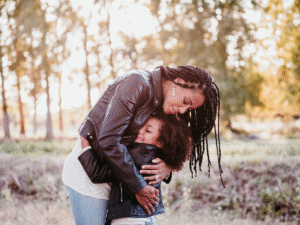 A mother and daughter embracing